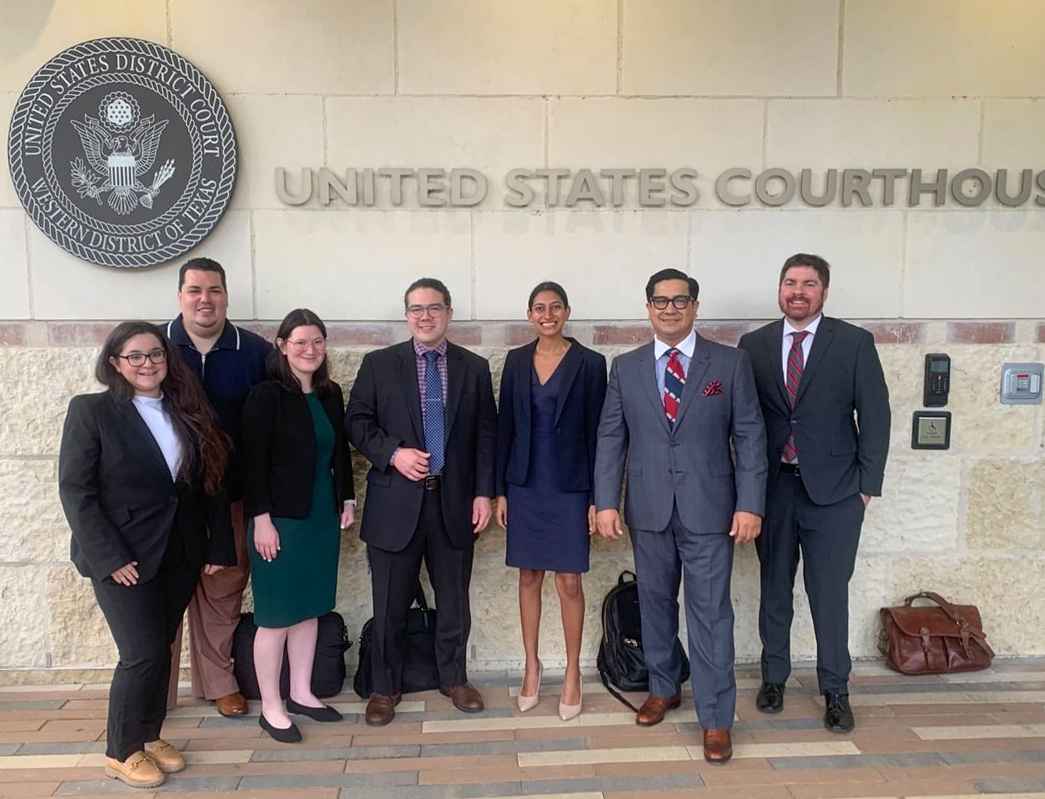 group picture of aclu of Texas lawyers in front of courthouse