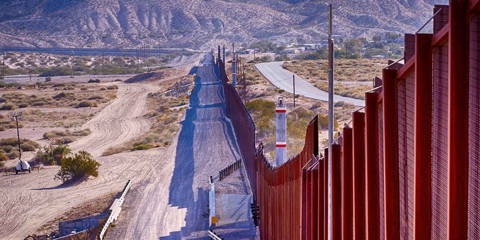 El Paso, Texas border wall between USA and Mexico running thru the desert.