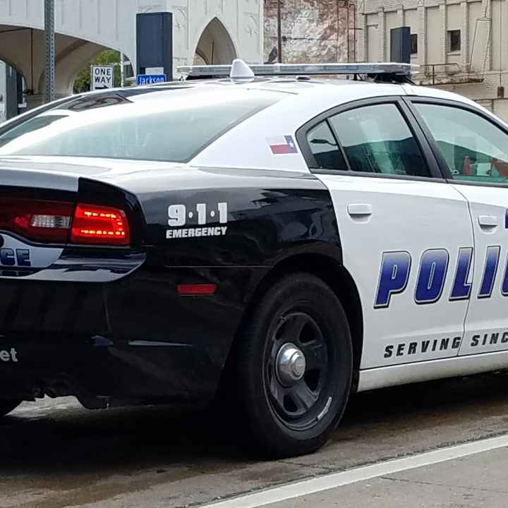 Image of a city of Dallas police squad car from the rear